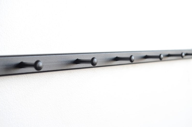 Metal wall mounted coat rack