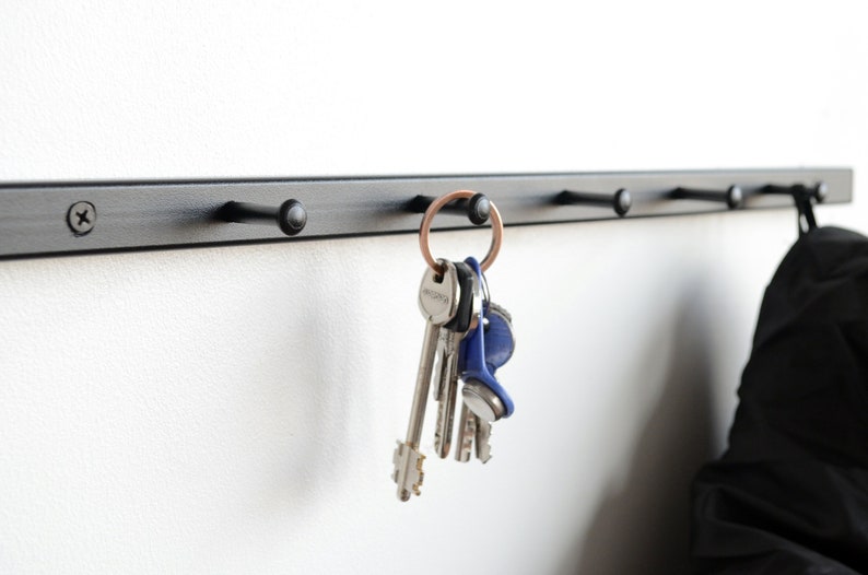 Metal wall mounted coat rack