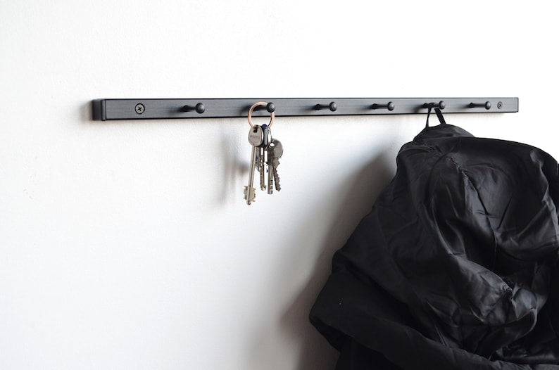 Metal wall mounted coat rack
